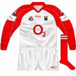 2002;
Cork hurling's darkest day, the qualifier loss to Galway, had Cusack wearing a version of the jersey with a plain red colalr and cuffs.