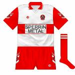 1993-94:
For the All-Ireland semi-final and final wins, Derry played in a new strip which featured the crest on the sleeve and shorts along with a 'v' motif. This style would be the basis of the county's kit for the next five years.