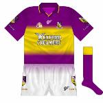 2003:
A new style was launched during the summer of 2003, and it was a quite a change. Mainly purple, the shirt featured a gradient effect with gold now limited to the midriff, more in keeping with the 'Yellow Bellies' nickname.