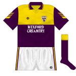1992:
In keeping with many other counties, Wexford's jersey received an upgrade, with the purple sleeves a big change. The size of the gold section of the body increased while Wexford Creamery were now the sponsors.